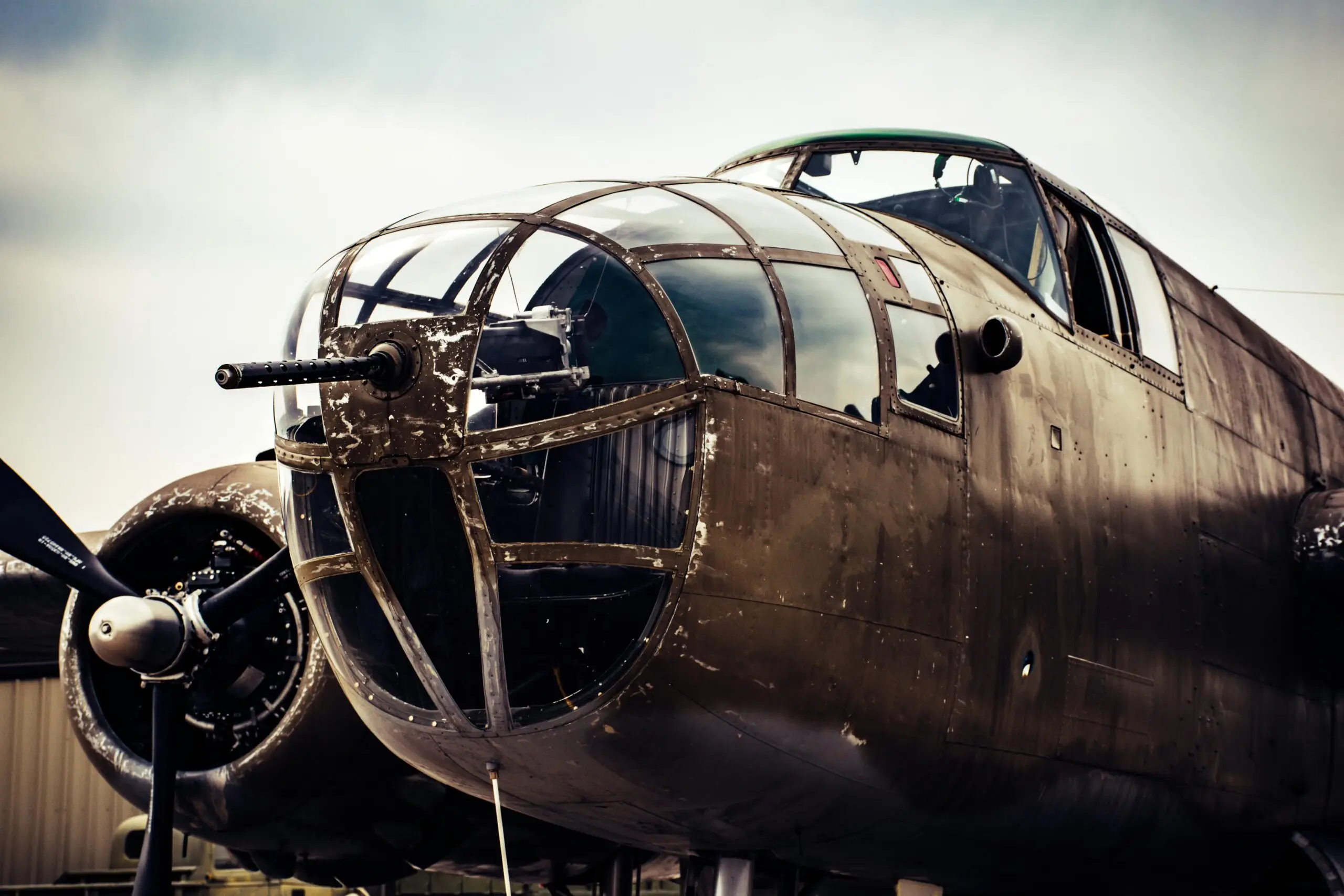 Close-up view of a vintage military aircraft cockpit showing intricate details and design.